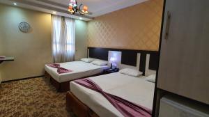 Siraj Hotel Mashhad, four beds