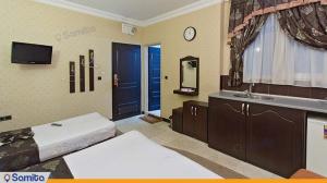 Triple room in Arsh Hotel Mashhad Triple room at Arsh Hotel